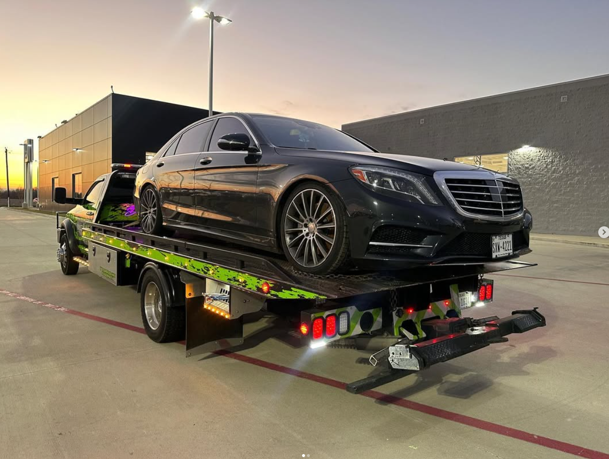 Luxury vehicle being towed